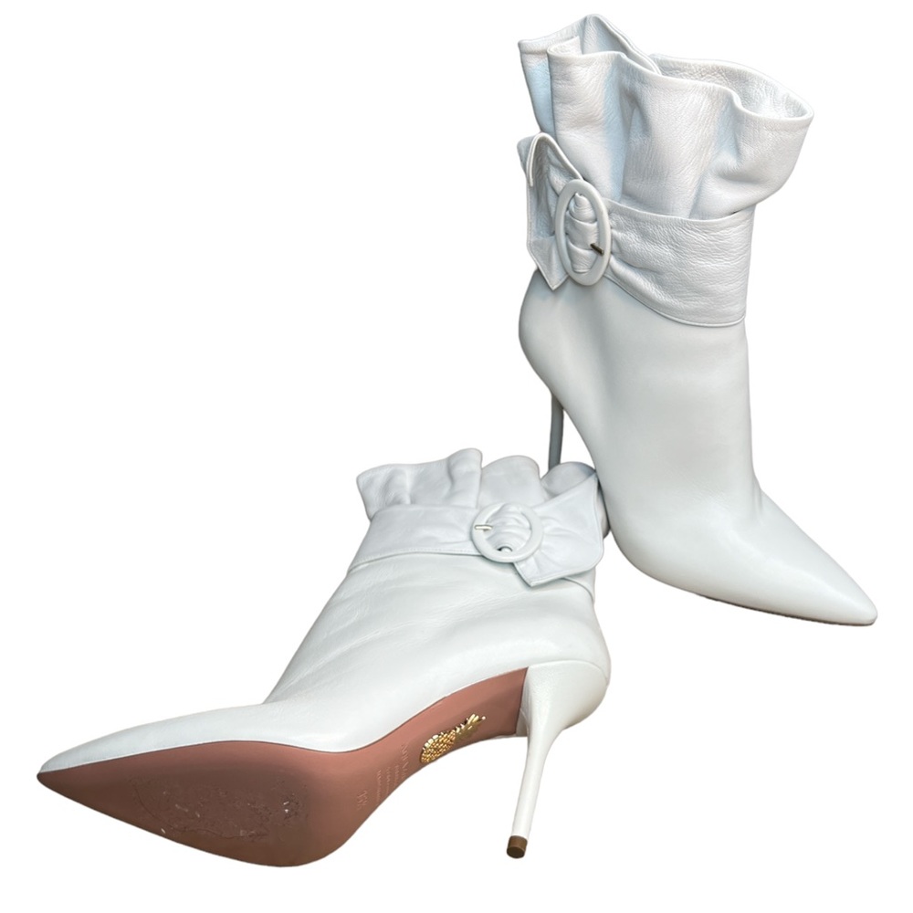 White Aquazzura boots, stiletto heel.